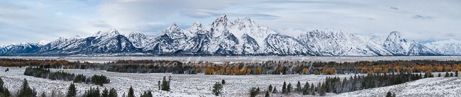 Jagged snowcapped peaks of the Grand Tetons rise above Jackson Valley
